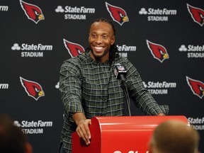 FILE - In this Dec. 23, 2018, file photo, Arizona Cardinals wide receiver Larry Fitzgerald speaks after an NFL football game against the Los Angeles Rams, in Glendale, Ariz. Star receiver Larry Fitzgerald is returning to the Arizona Cardinals for a 16th NFL season. The Cardinals announced Wednesday, Jan. 23, 2019, that they signed the 35-year-old Fitzgerald to a one-year contract. Team president Michael Bidwell says, "No player has meant more to this franchise or this community than Larry Fitzgerald."