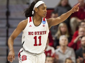 FILE - In this March 16, 2018, file photo, North Carolina State's Kiara Leslie (11) points to a teammate after hitting a 3-pointer during the first half of a first-round game in the NCAA women's college basketball tournament against Elon in Raleigh, N.C. The wins keep adding up for Kiara Leslie and eighth-ranked North Carolina State.  The Wolfpack women _ not traditional powers Connecticut or reigning national champion Notre Dame _ stand as Division I's last unbeaten team.