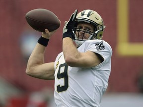 FILE - In this Dec. 9, 2018, file photo, New Orleans Saints quarterback Drew Brees (9) throws a pass before an NFL football game against the Tampa Bay Buccaneers, in Tampa, Fla. Drew Brees is about to play his first game at 40. It's also the biggest game he's played in nine seasons and a Super Bowl is on the line.