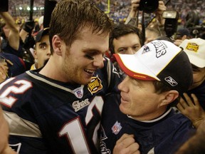 FILE - In this Feb. 1, 2004, file photo, New England Patriots MVP quarterback Tom Brady (12) and head coach Bill Belichick embrace after defeating the Carolina Panthers 32-29 in Super Bowl XXXVIII in Houston. The Patriots have dominated the AFC for nearly two decades _ if not the entire NFL _ and the coach-quarterback combination of Bill Belichick and Tom Brady will be playing in their eighth conference title game Sunday, Jan. 20, 2019, when New England visits the Chiefs at frigid, hostile Arrowhead Stadium.