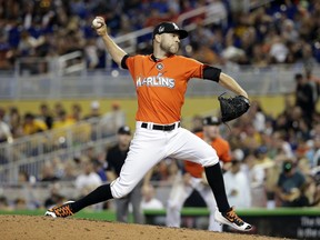 FILE - In this April 30, 2017, file photo, Miami Marlins relief pitcher David Phelps throws during the team's baseball game against the Pittsburgh Pirates in Miami. A person familiar with the negotiations tells The Associated Press that right-hander Phelps and the Toronto Blue Jays have agreed to a $2.5 million, one-year contract. The person spoke on condition of anonymity Thursday night, Jan. 10, 2019, because the deal had not yet been announced.
