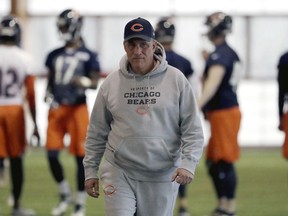 FILE - In this April 18, 2018, file photo, Chicago Bears defensive coordinator Vic Fangio watches players during the NFL football team's voluntary veteran minicamp in Lake Forest, Ill. A person with knowledge of the decision tells The Associated Press that Denver Broncos general manager John Elway has decided on Chicago Bears defensive coordinator Vic Fangio as his new head coach. The person spoke on condition of anonymity Wednesday, Jan. 9, 2019, because the team hadn't announced the hiring.