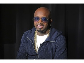 FILE - In this May 24, 2018, file photo, entertainer Jermaine Dupri is shown during an interview in New York. Big-name entertainers believe social injustice needs to be addressed during the Super Bowl and are ensuring the topic that ignited a political firestorm and engulfed the NFL will be in the spotlight.  Dupri says he was called a "sellout" during a meeting with people who had lost family members as result of police brutality. The music mogul plans to give mothers a platform to speak onstage during his Super Bowl Live event in Atlanta.