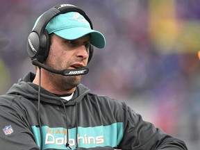 FILE - In this Sunday, Dec. 30, 2018 file photo, Miami Dolphins head coach Adam Gase watches the first half of an NFL football game against the Buffalo Bills in Orchard Park, N.Y. A person familiar with the decision says the New York Jets have hired former Miami Dolphins coach Adam Gase as their head coach. The person spoke to The Associated Press on condition of anonymity on Wednesday, Jan. 9, 2019 night because the team had not yet announced the hiring.