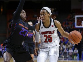 FILE - In this Monday, Nov. 19, 2018 file photo, Louisville guard Asia Durr (25) drives towards the basket while under pressure from Boise State guard Jayde Christopher (23) in the first half of an NCAA college basketball game in Boise, Idaho. The Associated Press polled a panel of WNBA coaches and general managers for a mock draft of the two rounds this spring. The top three picks remained the same from the first mock draft with Teaira McCowan, Asia Durr and Kalani Brown going 1-2-3.