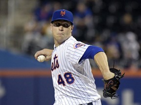 FILE - In this Sept. 26, 2018, file photo, New York Mets pitcher Jacob deGrom delivers the ball to the Atlanta Braves during the second inning of a baseball game in New York. NL Cy Young Award winner Jacob deGrom and the New York Mets agreed to a $17 million, one-year contract, a record raise for an arbitration-eligible player from his $7.4 million salary. The deal was agreed to Friday, Jan. 11, 2019, before the pitcher and team were to exchange proposed salaries in arbitration.