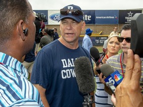 FILE - In this July 28, 2018, file photo, Dallas Cowboys offensive coordinator Scott Linehan talks with the media after morning practice at NFL football training camp, in Oxnard, Calif. Scott Linehan is out as offensive coordinator of the Dallas Cowboys only days after coach Jason Garrett sent mixed messages about the oft-criticized assistant's future. Garrett said in a statement released by the team Friday, Jan. 18, 2019, that he and Linehan had some open discussions this week and mutually agreed that a change was needed after five seasons.