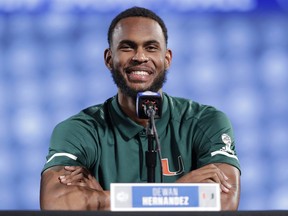 FILE - In this Oct. 24, 2018, file photo, Miami's Dewan Hernandez speaks to the media during a news conference at the Atlantic Coast Conference NCAA college basketball media day in Charlotte, N.C. Miami Hurricanes coach Jim Larranaga says junior forward Dewan Hernandez deserves to be declared eligible by the NCAA because he unwittingly became entangled in a college basketball corruption case when he was duped by an AAU coach. Larranaga spoke at length about Hernandez's status for the first time Friday, Jan. 18, 2019, as the school awaited an NCAA ruling.