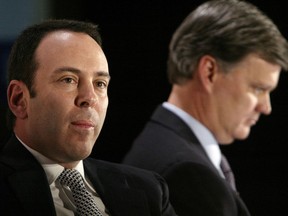 FILE- In this Nov. 17, 2004, file photo Kmart chairman Edward Lampert, left, and Sears CEO Alan Lacy listen during a news conference to announce the merger of Kmart and Sears in New York. As Sears teeters on the brink of collapse, there's one man at the center of the fight for the future of the iconic retailer. Lampert plays several, often conflicting, roles in what could be the final chapter for the company that began as a mail order watch business 132 years ago. He's been chairman, CEO, landlord, lender, and largest shareholder all at the same time. If the company survives, he wins. If it ends up liquidating, he also wins.