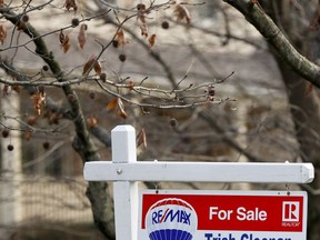 FILE- In this Jan. 3, 2019, file photo a realtor sign marks a home for sale in Franklin Park, Pa. On Tuesday, Jan. 22, the National Association of Realtors reports on sales of existing homes in December.