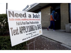 In this Jan. 3, 2019, photo customers enter a McDonald's restaurant near an employment sign in Atlantic Highlands, N.J. On Wednesday, Jan. 30, payroll processor ADP reports how many jobs private employers added in January.