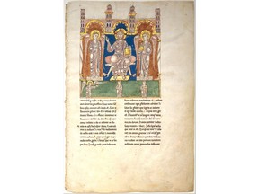 This image provided by the Metropolitan Museum of Art shows, a leaf from a Beatus Manuscript: Christ in Majesty with Angels and the Angel of God Directs Saint John to Write the Book of Revelation, ca. 1180. Modern-day scientists who examined the 1,000 year-old remains of a middle-aged woman in Germany discovered lapis lazuli, a semi-precious stone, in the tartar on her teeth. From that, they concluded the woman was an artist involved in creating illuminated manuscripts, a task usually associated with monks. The find is considered the most direct evidence yet of a woman taking part in the making of high-quality illuminated manuscripts, the lavishly illustrated religious and secular texts of the Middle Ages. And it corroborates other findings that suggest female artisans were not as rare as previously thought.  (Metropolitan Museum of Art via AP)