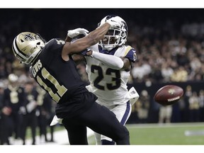 FILE - In this Jan. 20, 2019, file photo, Los Angeles Rams' Nickell Robey-Coleman breaks up a pass intended for New Orleans Saints' Tommylee Lewis during the second half of the NFL football NFC championship game in New Orleans. A quest by two New Orleans Saints ticketholders to force a full or partial do-over of this year's NFC championship game because of a blown "no-call" by game officials was rejected Thursday, Jan. 31, 2019, by a federal judge.