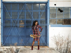 This Jan. 6, 2019 photo shows saxophonist Tia Fuller posing in Piscataway, N.J. Fuller, who teaches at Berklee College of Music and famously toured with Beyonce as part of her all-female band, is nominated for her first Grammy in the best instrumental jazz album category.