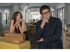 This image released by Netflix shows Rene Russo, left, and Jake Gyllenhaal in a scene from "Velvet Buzzsaw."