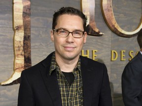 FILE - This Dec. 2, 2013 file photo shows Bryan Singer at the Los Angeles premiere of "The Hobbit: The Desolation of Smaug."  Singer has been accused of sexually assaulting minors in a new expose published by the Atlantic. The Atlantic on Wednesday, Jan. 23, 2019, published a lengthy article about four alleged victims who said they were seduced and molested by the "Bohemian Rhapsody" director while underage.