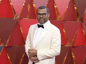 FILE - In this March 4, 2018 file photo, Jordan Peele arrives in Los Angeles. Peele's "Us," his anticipated follow-up to "Get Out," will make its world premiere at the South by Southwest Film Festival. SXSW announced Tuesday that "Us" will open the 26th edition of the Austin, Texas, festival on March 8. Like Peele's "Get Out," "Us" is a socially minded horror thriller.