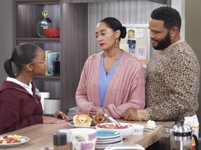 This image released by ABC shows Marsai Martin, from left, Tracee Ellis Ross and Anthony Anderson in a scene from "black-ish." In the episode airing on Tuesday, Jan. 15, Dre, played by Anderson, and Bow, played by Ross, are furious after Diane, played by Martin, isn't lit properly in her class photo. The episode outlines the history of colorism in depth while injecting some humor.