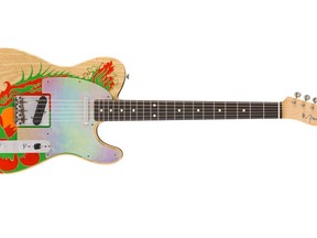 This image released by Fender shows a recreation of a Telecaster guitar that Jimmy Page once painted with a dragon, a long-lost piece of six-string history that marked the guitar hero's last days in the Yardbirds and first days in Led Zeppelin. Fender craftsman Paul Waller, who worked with Page to reboot the dragon, says it represents "a pivotal moment for the guitar and for music." (Fender via AP)