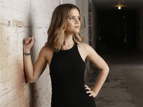 FILE - In this May 31, 2016, file photo, singer Maren Morris poses in Nashville, Tenn. Morris is nominated in both country, pop and all-genre categories this year, including two nominations in the country genre categories for "Dear Hate," a duet with Vince Gill released after the Las Vegas mass shooting, and a nomination for "Mona Lisas and Mad Hatters," a cover from an Elton John tribute album. Her song "The Middle" with EDM artists Zedd and Grey, is nominated for record and song of the year at this year's Grammy Awards on Feb. 10, and Morris was also nominated for best pop duo/group collaboration.