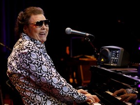 In this Jan. 16, 2019 photo, Ronnie Milsap poses for a photo on the stage of The Ryman Auditorium in Nashville, Tenn. Milsap's new album, "Ronnie Milsap: The Duets," comes out on Friday.