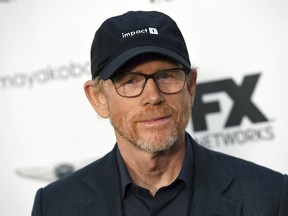FILE - In this Sept. 16, 2018, file photo, filmmaker Ron Howard poses at a private cocktail party to celebrate the FX network's Emmy nominations in Los Angeles. Howard is planning to make a documentary about a California town's attempt to rebuild after the destruction of the 2018 California wildfires. National Geographic Documentary Films announced the project Thursday which will focus on the Sierra Nevada foothills town of Paradise, California. In November of 2018, the wildfires took over 14,000 homes and displaced over 50,000 people. Its working title is "Rebuilding Paradise."