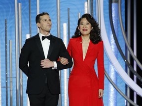 This image released by NBC shows hosts Andy Samberg, left, and Sandra Oh at the 76th Annual Golden Globe Awards at the Beverly Hilton Hotel on Sunday, Jan. 6, 2019, in Beverly Hills, Calif.