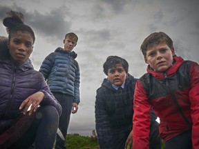 This image released by 20th Century Fox shows, from left, Rhianna Dorris, Tom Taylor, Dean Chaumoo, and Louis Ashbourne Serkis in a scene from "The Kid Who Would Be King."