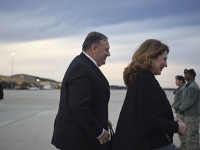 U.S. Secretary of State Mike Pompeo and his wife Susan Pompeo walk to the plane prior to departing from Joint Base Andrews on Monday, Jan. 7, 2019. Pompeo is traveling to the Middle East.