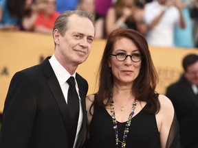 FILE - In this Jan. 25, 2015, file photo, Steve Buscemi, left, and his wife Jo Andres arrive at the 21st annual Screen Actors Guild Awards at the Shrine Auditorium in Los Angeles. Andres, a filmmaker and choreographer, has died. She was 64. Andres was married to Buscemi for more than three decades. Buscemi's representative, Staci Wolfe, confirmed Andres' death to The Associated Press on Sunday, Jan. 13, 2019.