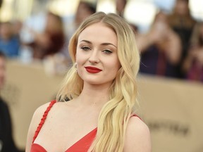 FILE - In this Jan. 29, 2017, file photo, Sophie Turner arrives at the 23rd annual Screen Actors Guild Awards at the Shrine Auditorium & Expo Hall in Los Angeles. HBO announced Sunday night, Jan. 13, 2019, that the eighth and final season of "Game of Thrones" will begin on April 14. In a one minute and 44 second teaser released Sunday, Arya Stark (Maisie Williams), Sansa Stark (Sophie Turner) and Jon Snow (Kit Harington) are seen in the crypts of Winterfell.