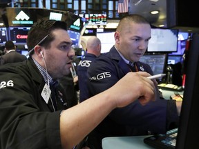 nullFILE- In this Jan. 11, 2019, file photo, trader Joseph Lawler, left, and specialist Mark Otto work on the floor of the New York Stock Exchange. The U.S. stock market opens at 9:30 a.m. EST on Thursday, Jan. 17.