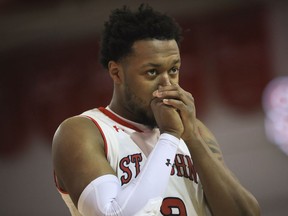 St. John's guard Shamorie Ponds blows into his hands during the first half of the team's NCAA college basketball game against Marquette on Tuesday, Jan. 1, 2019, in New York.