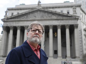 Brian Toale, 65, a sexual abuse victim when he was a student in a Long Island Catholic school, and now an activist, poses for a photograph in front of Thurgood Marshall Courthouse in New York's Foley Square on Wednesday, Jan. 9, 2019. Toale is in favor of revising existing statute of limitations laws to give victims of long-ago sex abuse a window to get their day in court. As a new legislative season begins, prospects for reforming such laws are high, especially in New York State.