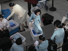 An airline flight crew passes through a TSA checkpoint, Monday, Jan. 7, 2019, at New York's John F. Kennedy International Airport. Senate Minority Leader Chuck Schumer, D-N.Y., suggested Sunday that the partial government shutdown is disrupting Transportation Security Administration operations.