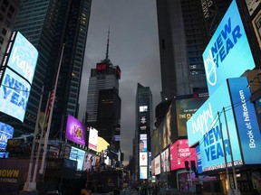Billboards welcome in the new year in New York's Times Square, Monday, Dec. 31, 2018.