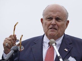 FILE - In this Aug. 1, 2018, file photo, Rudy Giuliani, an attorney for President Donald Trump, speaks in Portsmouth, N.H. On Monday, Jan. 21, 2019, Giuliani walked back comments he made about discussions Trump had with his former personal attorney about a real estate project in Moscow during the presidential election campaign.