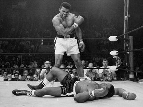 FILE - In this May 25, 1965, file photo, heavyweight champion Muhammad Ali stands over fallen challenger Sonny Liston shortly after dropping him with a short hard right to the jaw in Lewiston, Maine. Ali's Kentucky hometown will honor the late boxer by renaming its airport for him. The Louisville Regional Airport Authority's board voted Wednesday, Jan. 16, 2019, to change the name to Louisville Muhammad Ali International Airport. Ali would have turned 77 Thursday. He died in 2016.