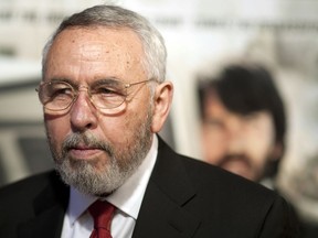 FILE - In an Oct. 10, 2012 file photo, Antonio "Tony" Mendez, former CIA technical operations officer, poses for photographers at the premiere of the film Argo in Washington.  Mendez, a former CIA technical operations officer who helped rescue six U.S. diplomats from Iran in 1980 and was portrayed by Ben Affleck in the film "Argo," died Saturday, Jan. 19, 2019, at an assisted-living center in Frederick, Maryland, according to a family statement and his literary agent. He was 78.