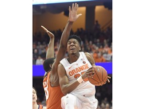 Syracuse guard Tyus Battle (25) drives past Clemson's Trey Jemison during an NCAA college basketball game Wednesday, Jan. 9, 2019, in Syracuse, N.Y.
