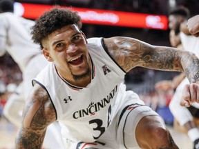 Cincinnati's Jarron Cumberland reacts after scoring in the first half of the team's NCAA college basketball game against South Florida, Tuesday, Jan. 15, 2019, in Cincinnati.