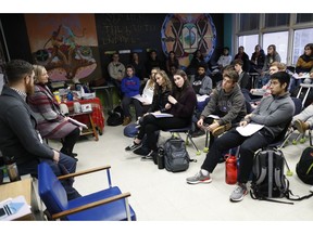 In this Thursday, Jan. 24, 2019, photo students listen as social studies teachers Judi Galasso and Jonathan Duffy lead the introductory class of their American Thought and Political Radicalism course at Thomas Worthington High School,  in Worthington, Ohio.
