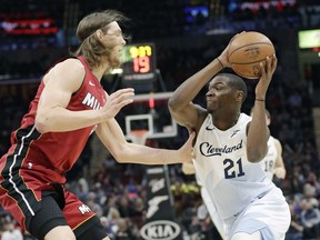 Cleveland Cavaliers' Jalen Jones, right, drives past Miami Heat's Kelly Olynyk in the first half of an NBA basketball game, Wednesday, Jan. 2, 2019, in Cleveland.