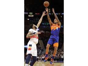 Cleveland Cavaliers' Jordan Clarkson (8) shoots over New Orleans Pelicans' Anthony Davis (23) in the first half of an NBA basketball game, Saturday, Jan. 5, 2019, in Cleveland.
