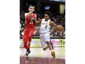 Cleveland Cavaliers' Collin Sexton (2) drives past Washington Wizards' Tomas Satoransky (31) during the first half of an NBA basketball game Tuesday, Jan. 29, 2019, in Cleveland.