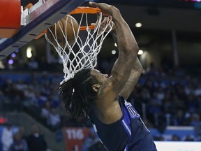 Dallas Mavericks center DeAndre Jordan dunks in the first half of an NBA basketball game against the Oklahoma City Thunder in Oklahoma City, Monday, Dec. 31, 2018.