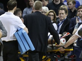 Oklahoma City Thunder forward Nerlens Noel is wheeled off the court on a stretcher in the second half of an NBA basketball game against the Minnesota Timberwolves in Oklahoma City, Tuesday, Jan. 8, 2019.