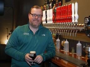 Sean Mossman, director of sales and marketing for COOP Ale Works, poses for a photo in the COOP taproom in Oklahoma City, Friday, Jan. 18, 2019.  Rules that went into effect in Oklahoma in October allow grocery, convenience and retail liquor stores to sell chilled beer with an alcohol content of up to 8.99 percent. Previously, grocery and convenience stores could offer only 3.2 percent beer. Liquor stores, where stronger beers were available, were prohibited from selling it cold.