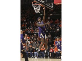 Washington's Nahziah Carter drives to the basket during the first half of an NCAA college basketball game against Oregon State in Corvallis, Ore., Saturday, Jan. 26, 2019.