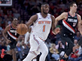 New York Knicks guard Emmanuel Mudiay (1) brings the ball upcourt against the Portland Trail Blazers during the first half of an NBA basketball game in Portland, Ore., Monday, Jan. 7, 2019.